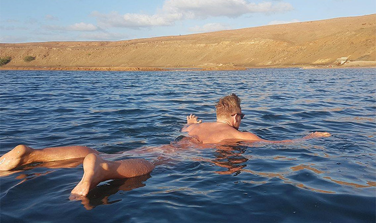 Lee Walpole floating in the salt lake in Cape Verde